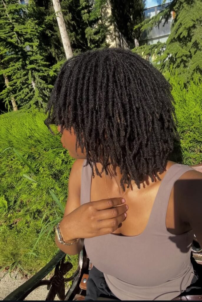 Longer-wear protective braids installed with visible slack at the roots
