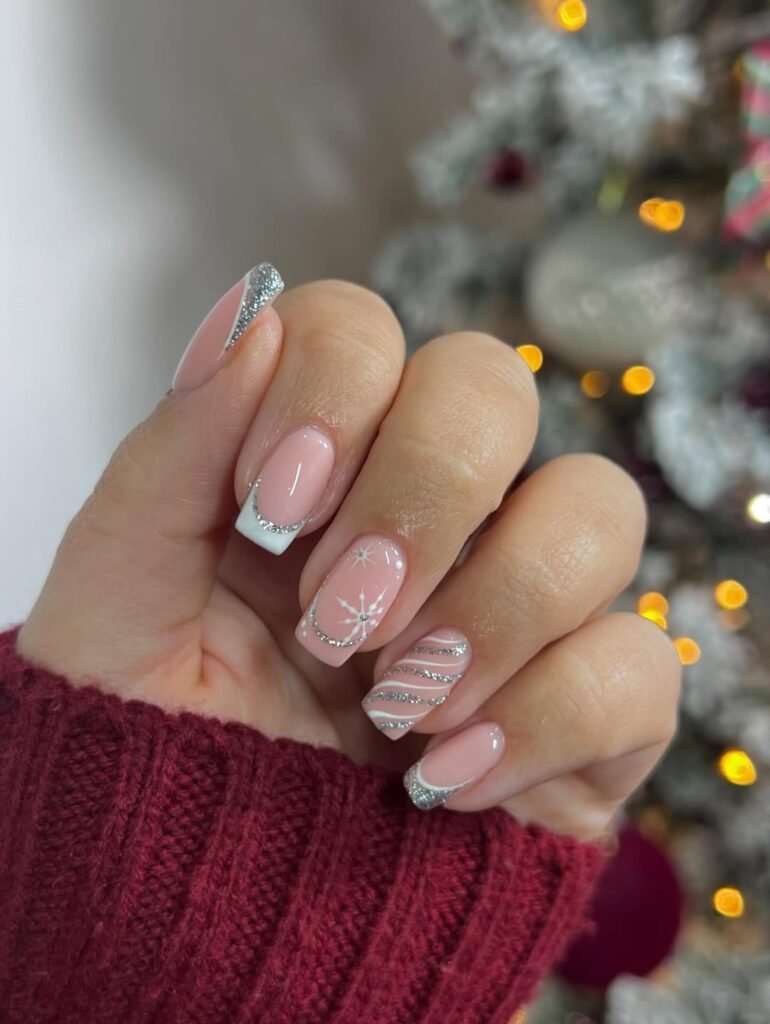 Elevated Christmas manicure in deep red with a subtle gold accent